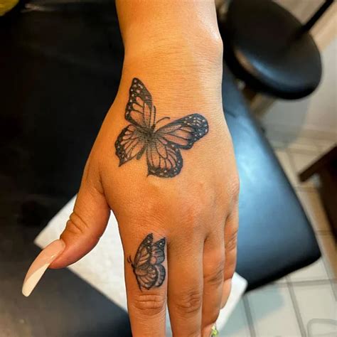 butterfly tattoo on hand|84 Unquestionably Rhythmic Butterfly Hand Tattoos。